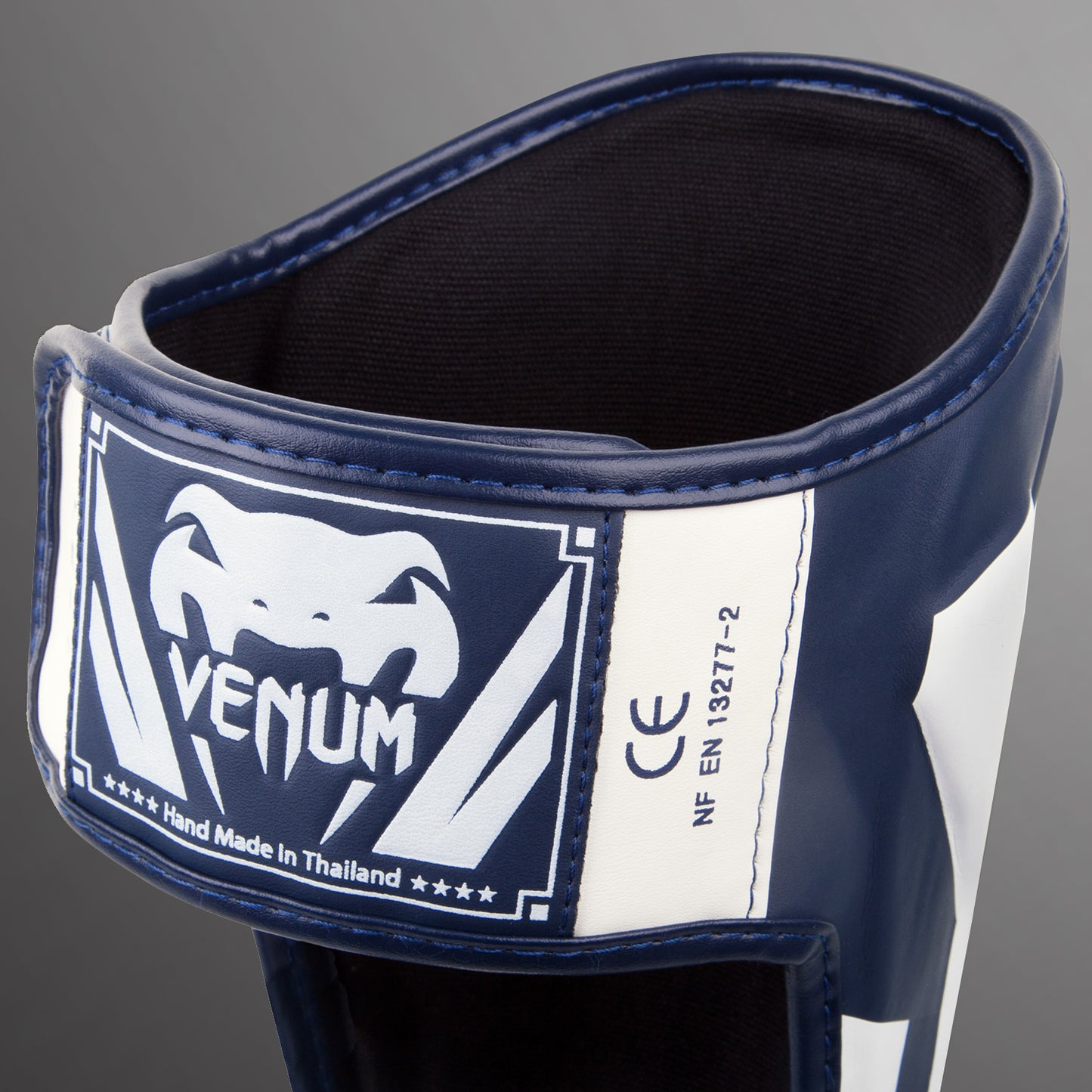 Espinilleras Venum Elite Standup - Blanco/Azul Marino