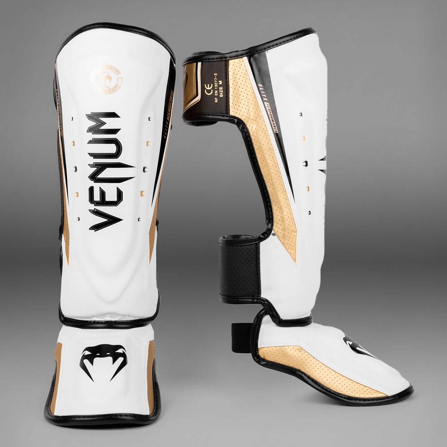 Espinilleras Venum Elite Evo - Blanco/Dorado