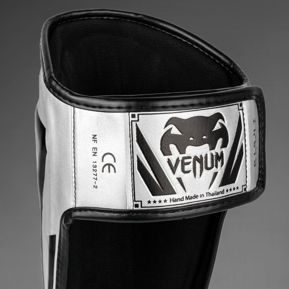 Venum Elite Espinilleras Standup - Plata/Negro