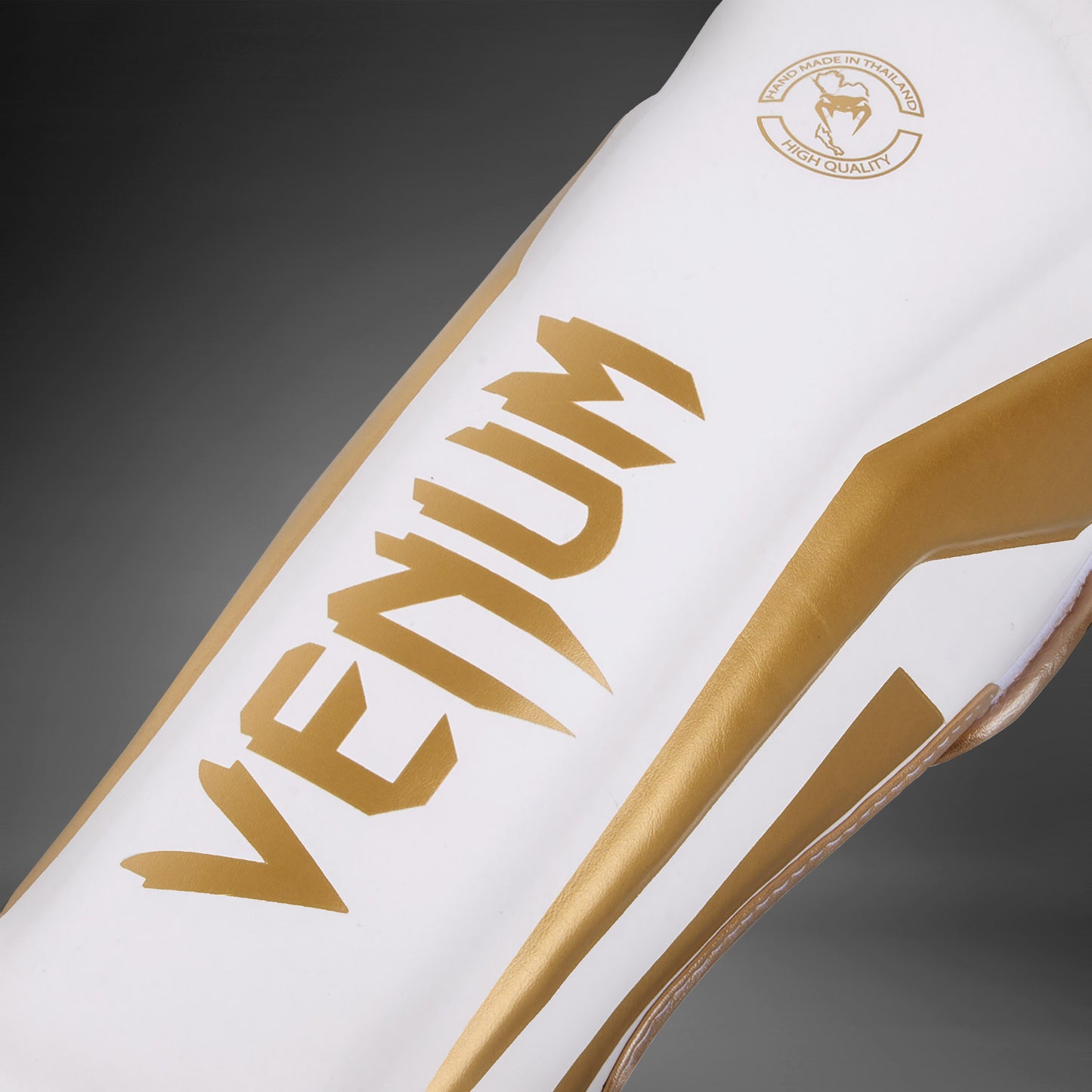 Espinilleras Venum Elite Standup - Blanco/Oro