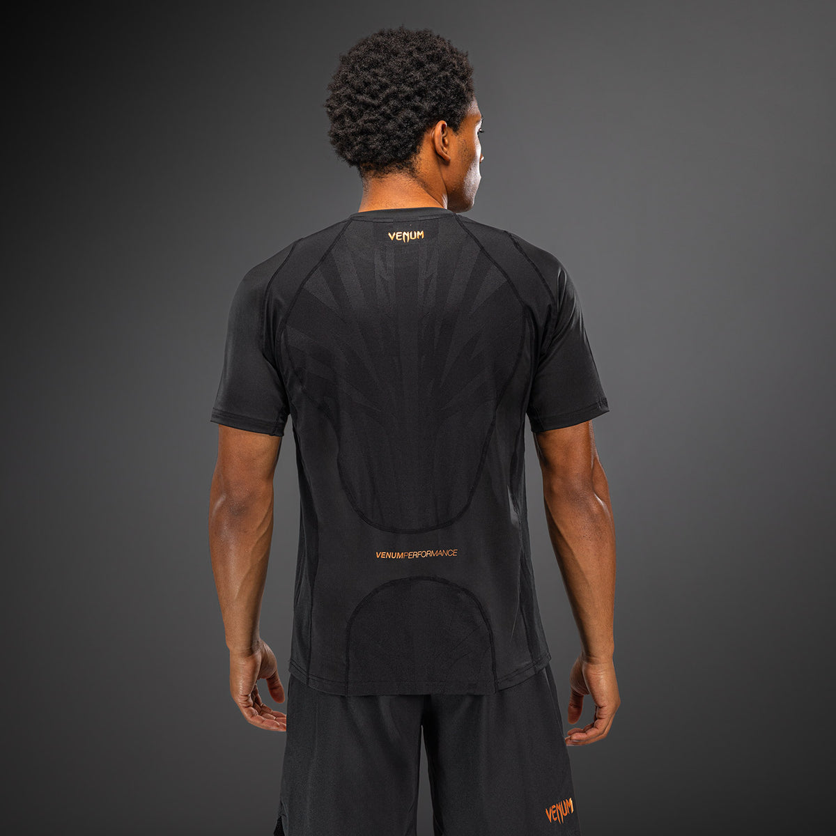 Venum G-Fit Revolution Camiseta Dry Tech - Negro/Cobre