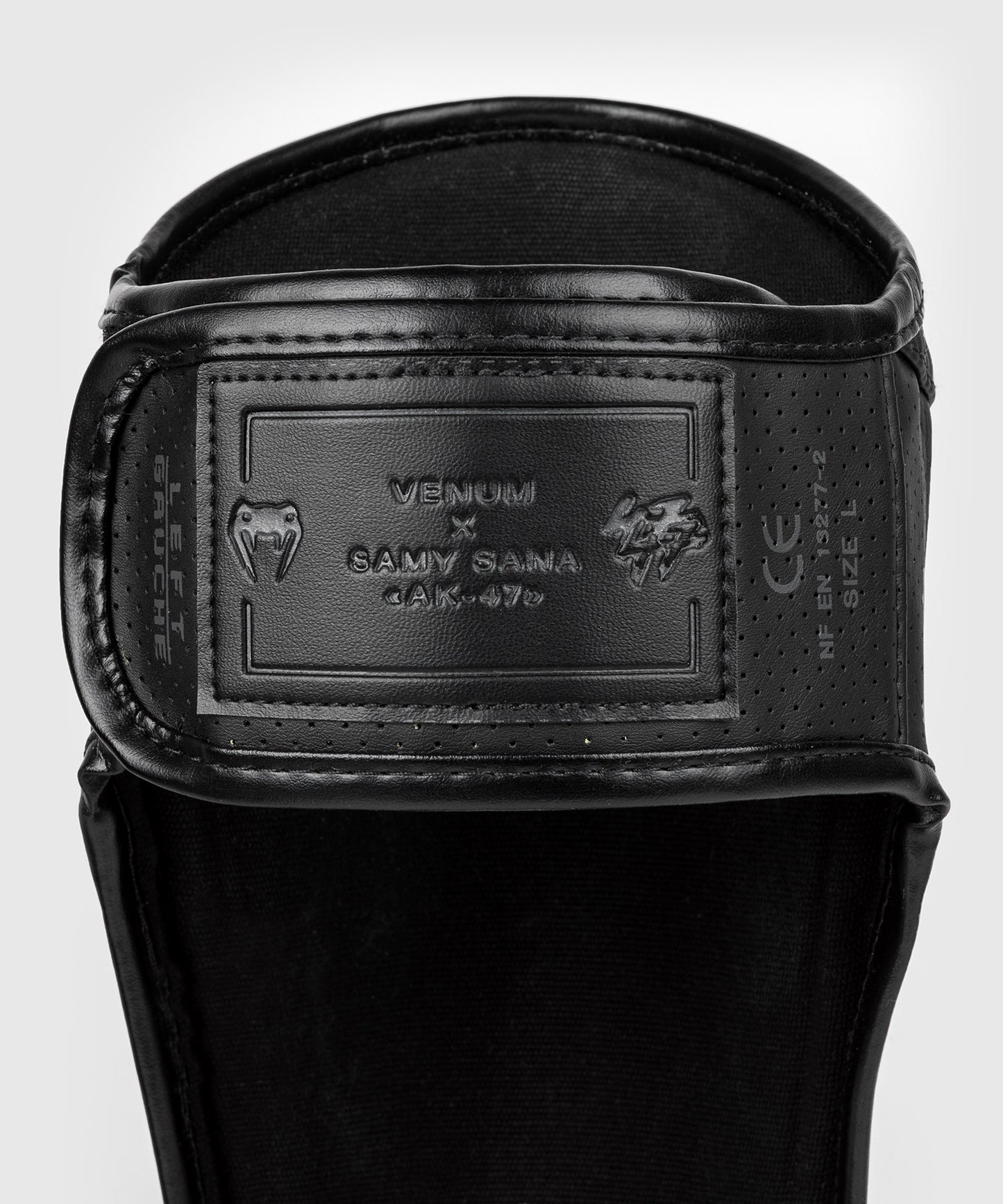Venum S47 Espinilleras - Negro/Naranja