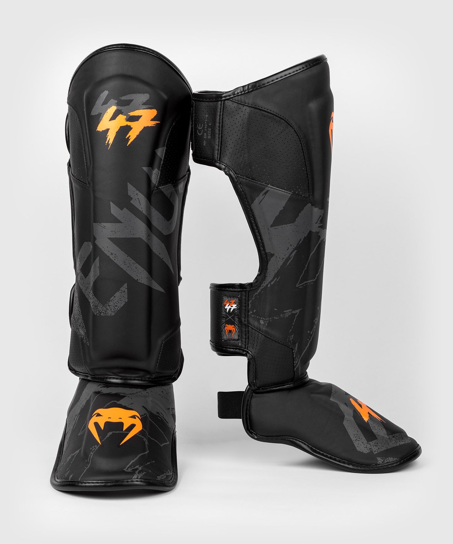 Venum S47 Espinilleras - Negro/Naranja