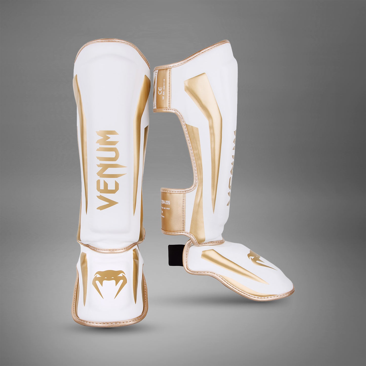 Espinilleras Venum Elite Standup - Blanco/Oro