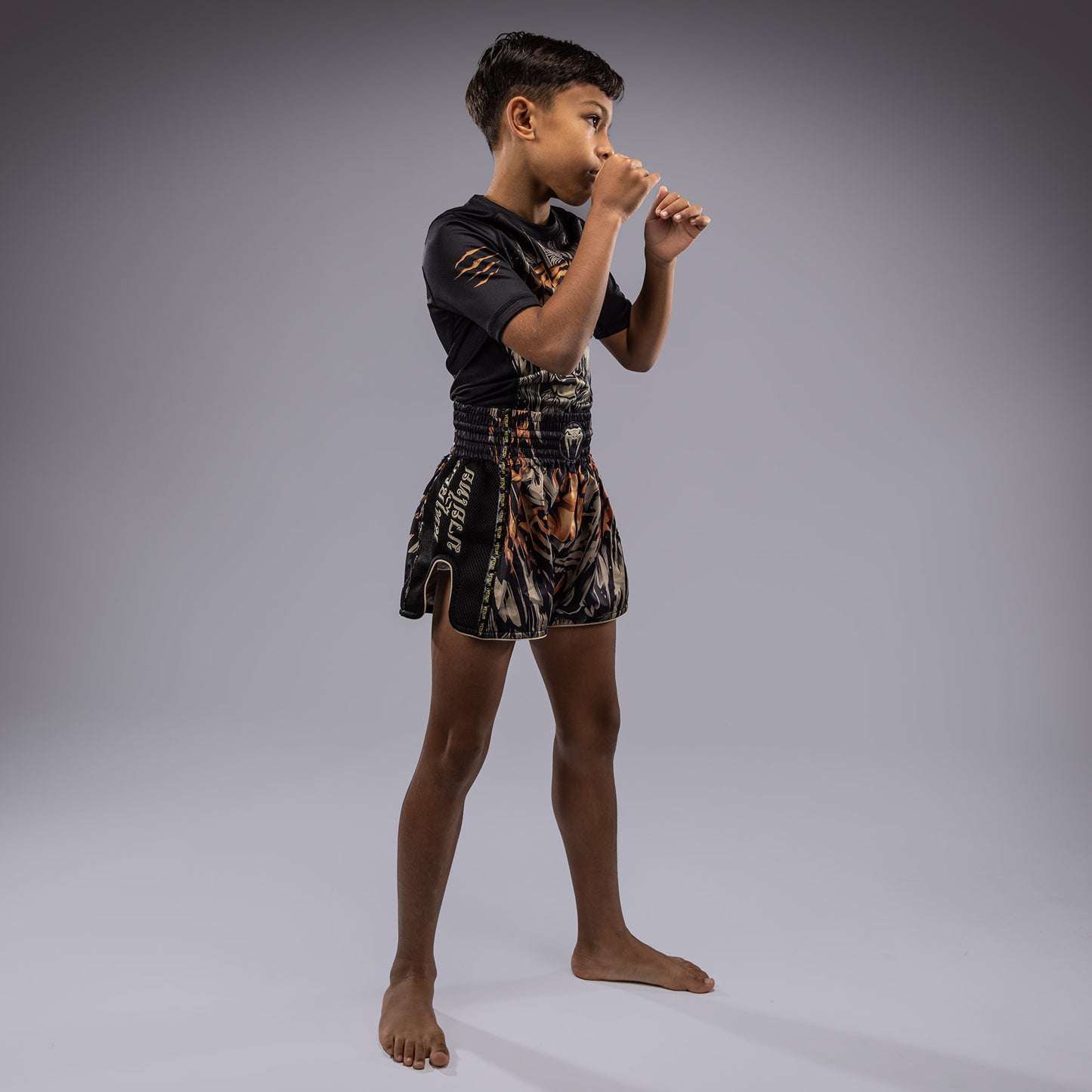 Venum Tiger Pantalones Cortos de Muay Thai para Niños - Negro/Naranja Neón