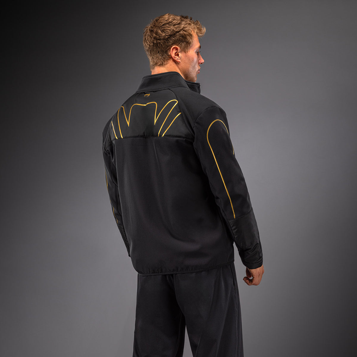 Venum Paddock Chaqueta softshell - Negro/Dorado