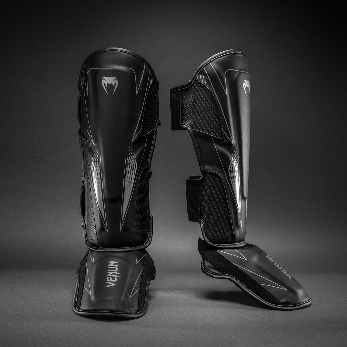 Venum Amazonia Reborn Espinilleras - Negro/Gris