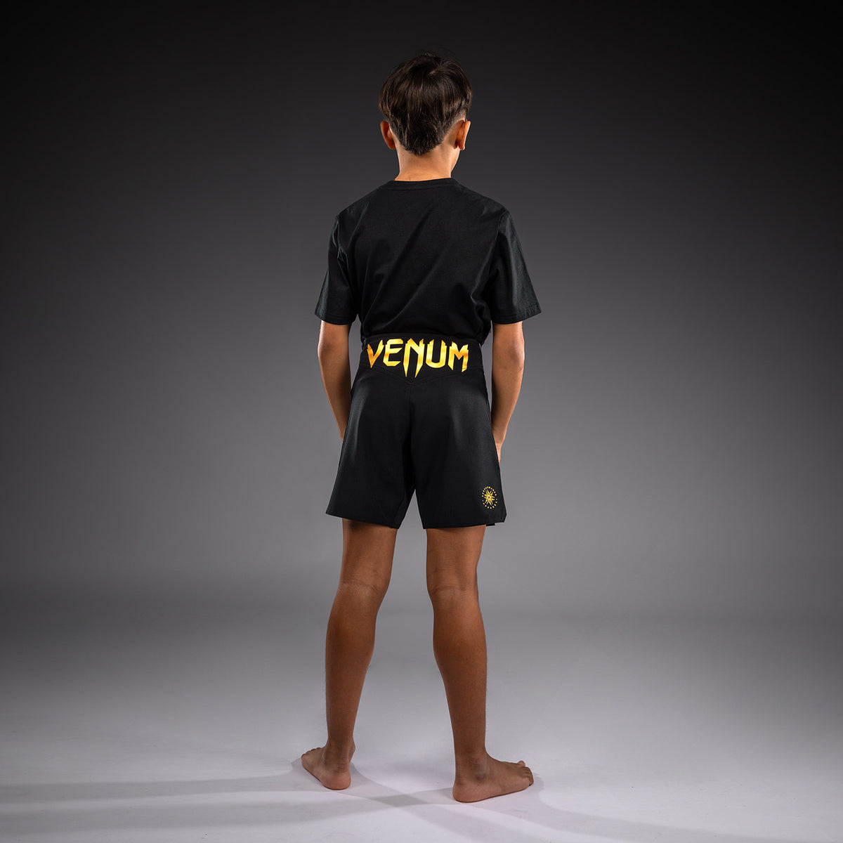 Venum Attack Fightshorts para niños - Negro/Dorado
