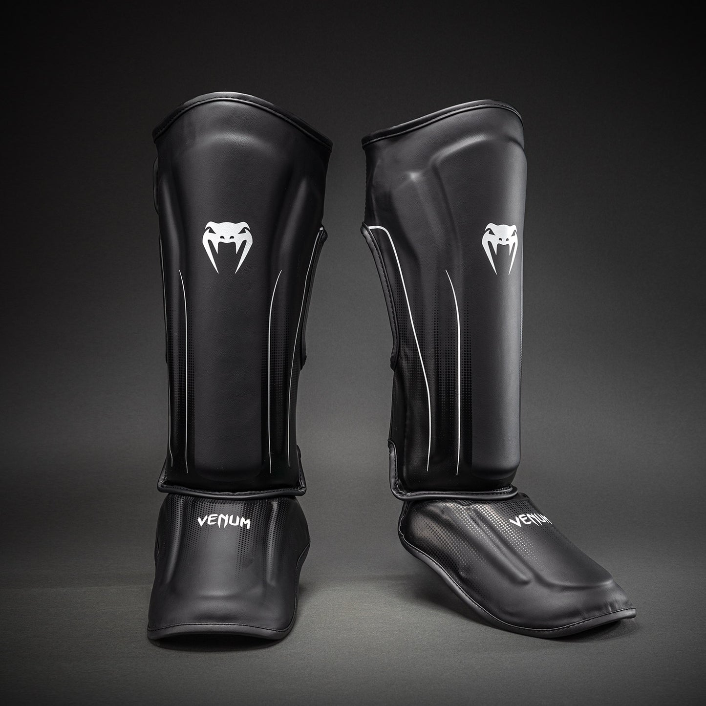 Venum Stealth Espinilleras – Negro/Blanco