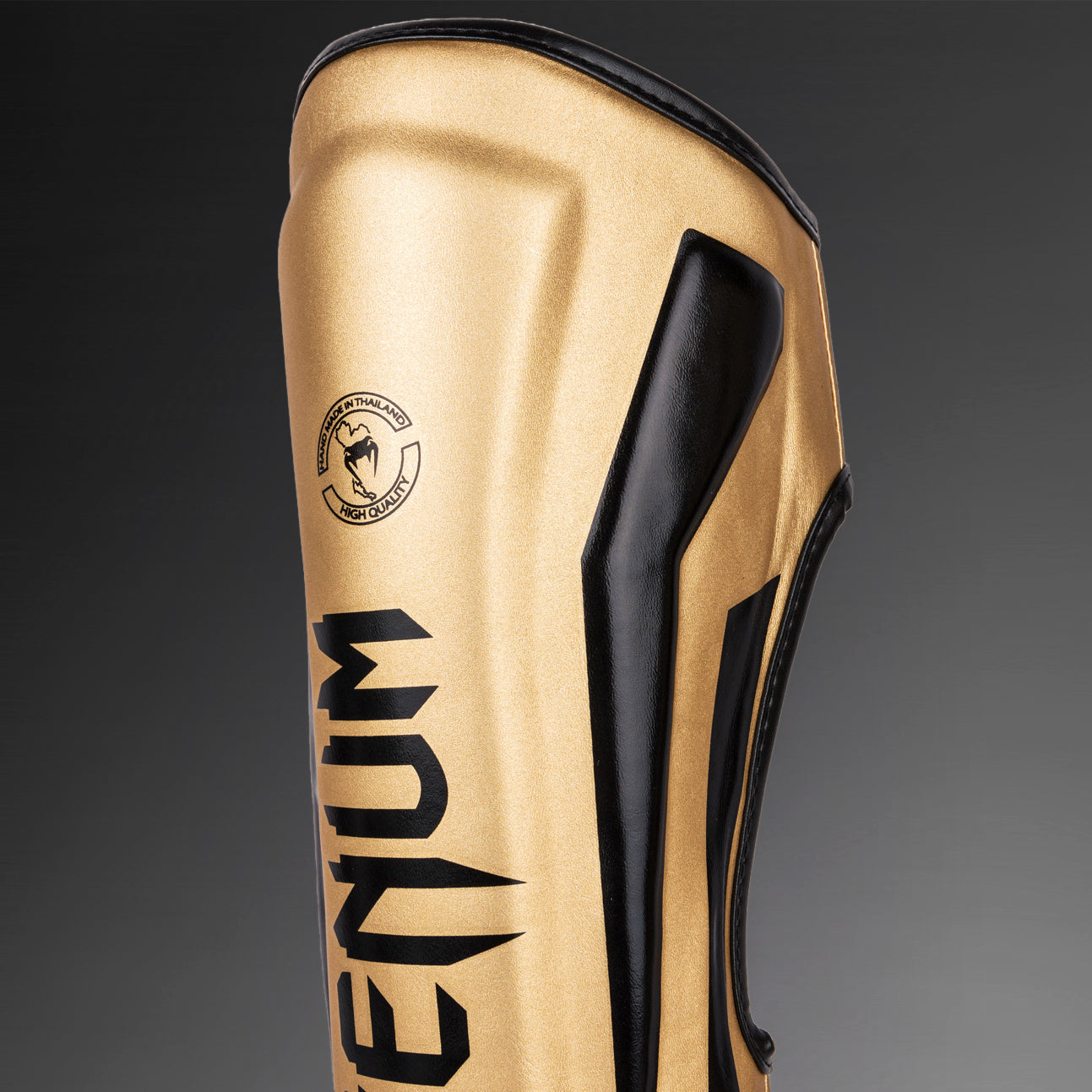 Venum Elite Espinilleras Standup - Oro/Negro