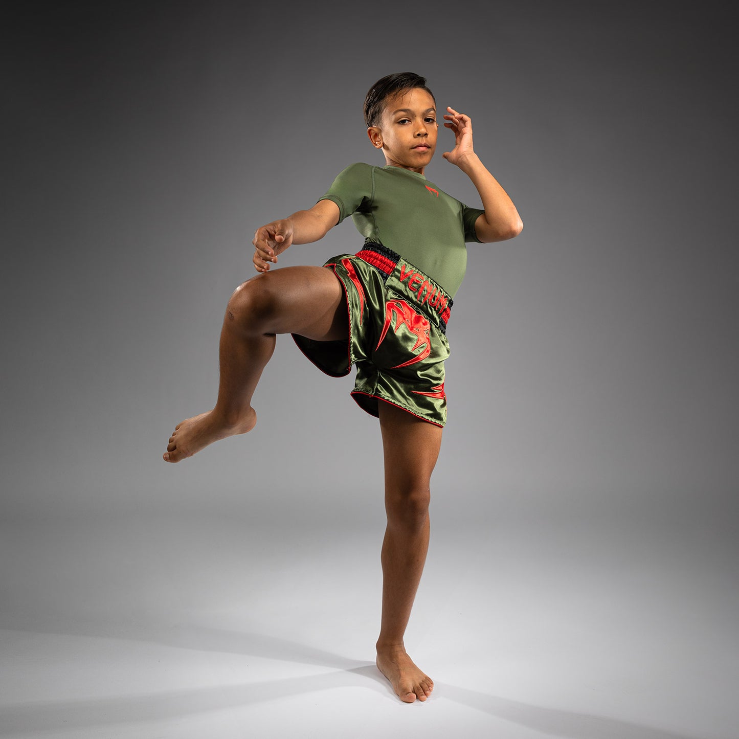 Venum Inferno Pantalones Cortos de Muay Thai para Niños - Verde Ejército/Naranja