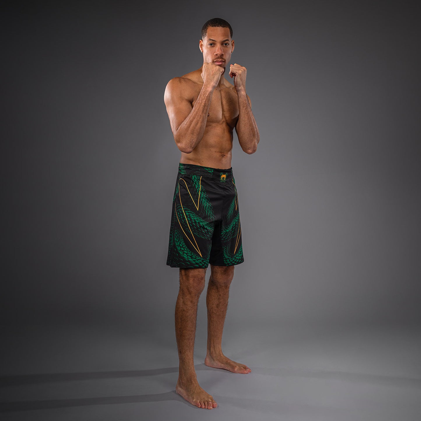 Venum Matupa Short de Combate - Negro/Verde/Oro