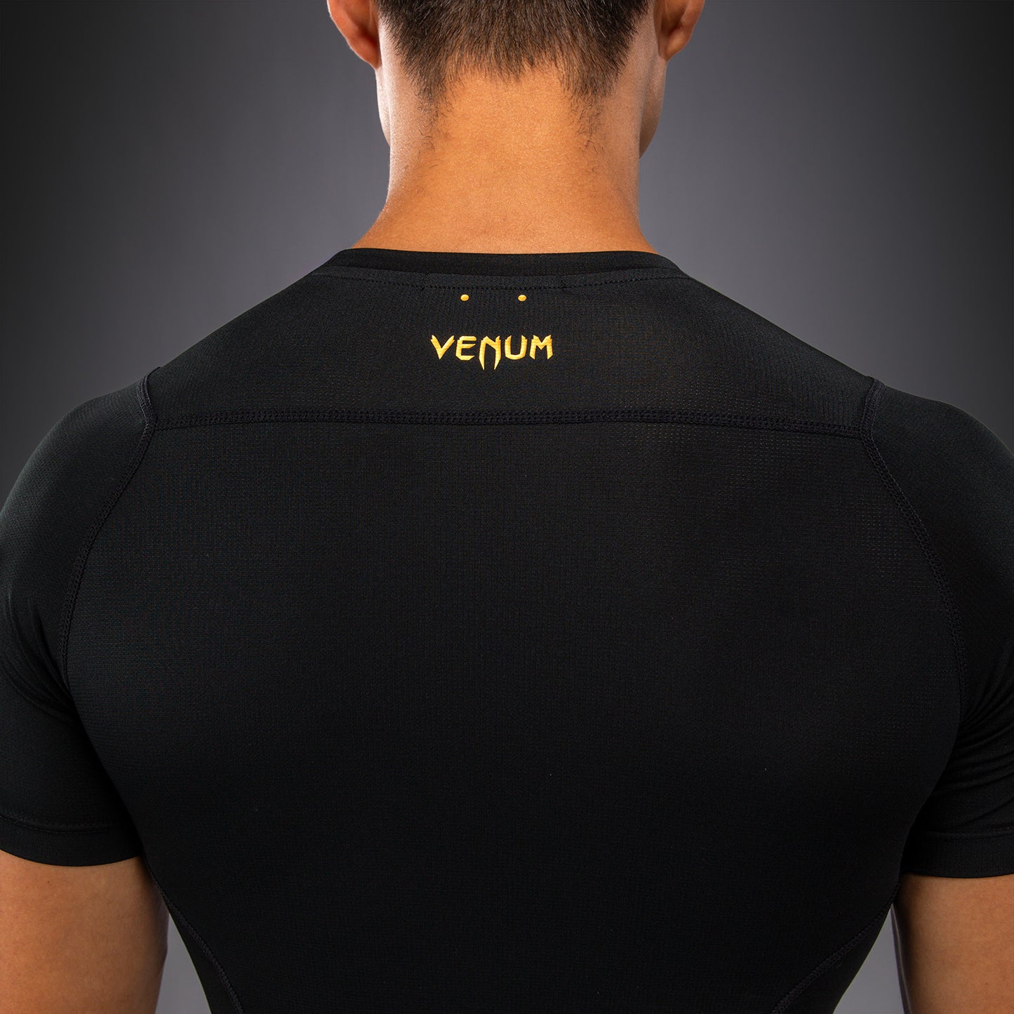 Venum G-Core Rashguard Manga Corta - Negro/Oro