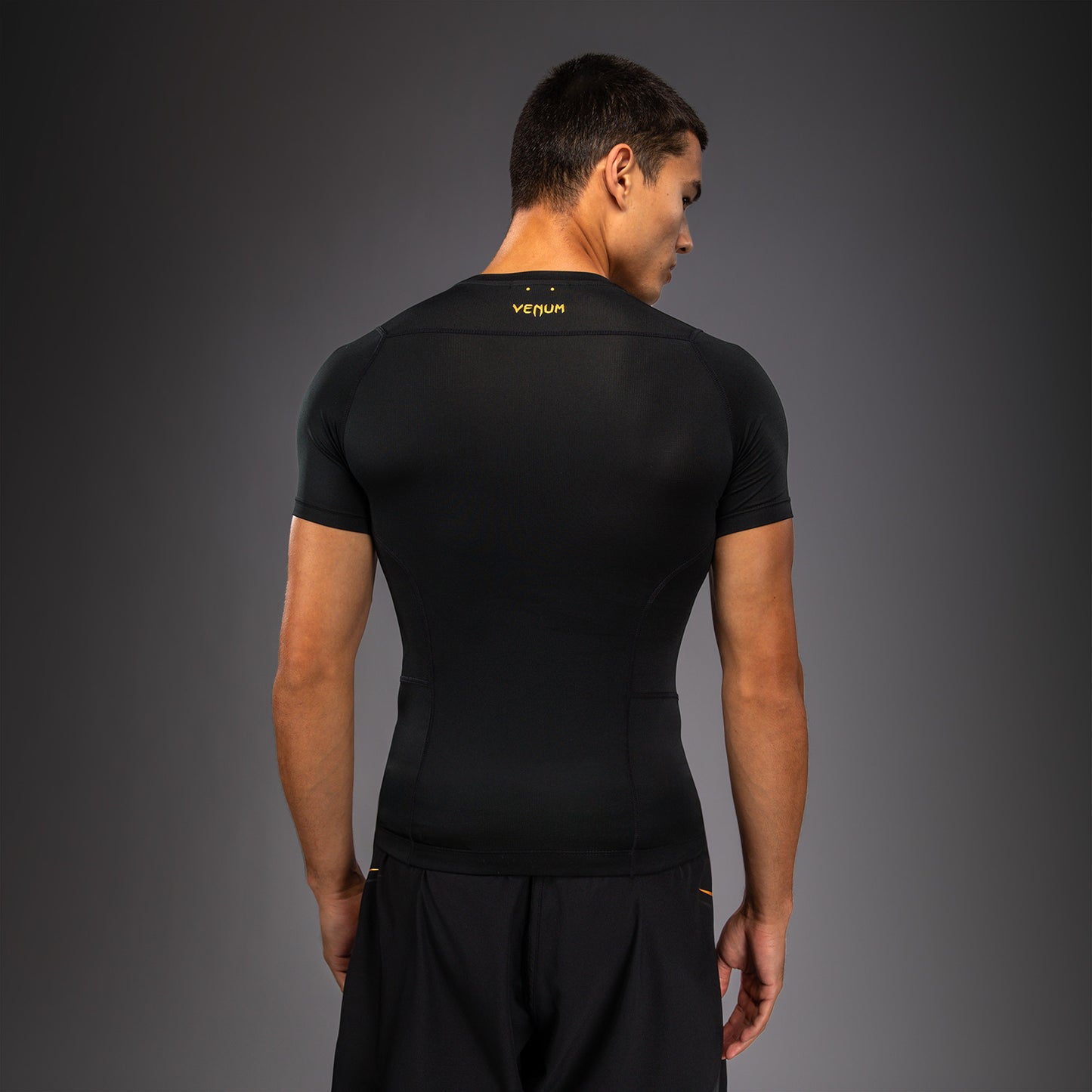 Venum G-Core Rashguard Manga Corta - Negro/Oro