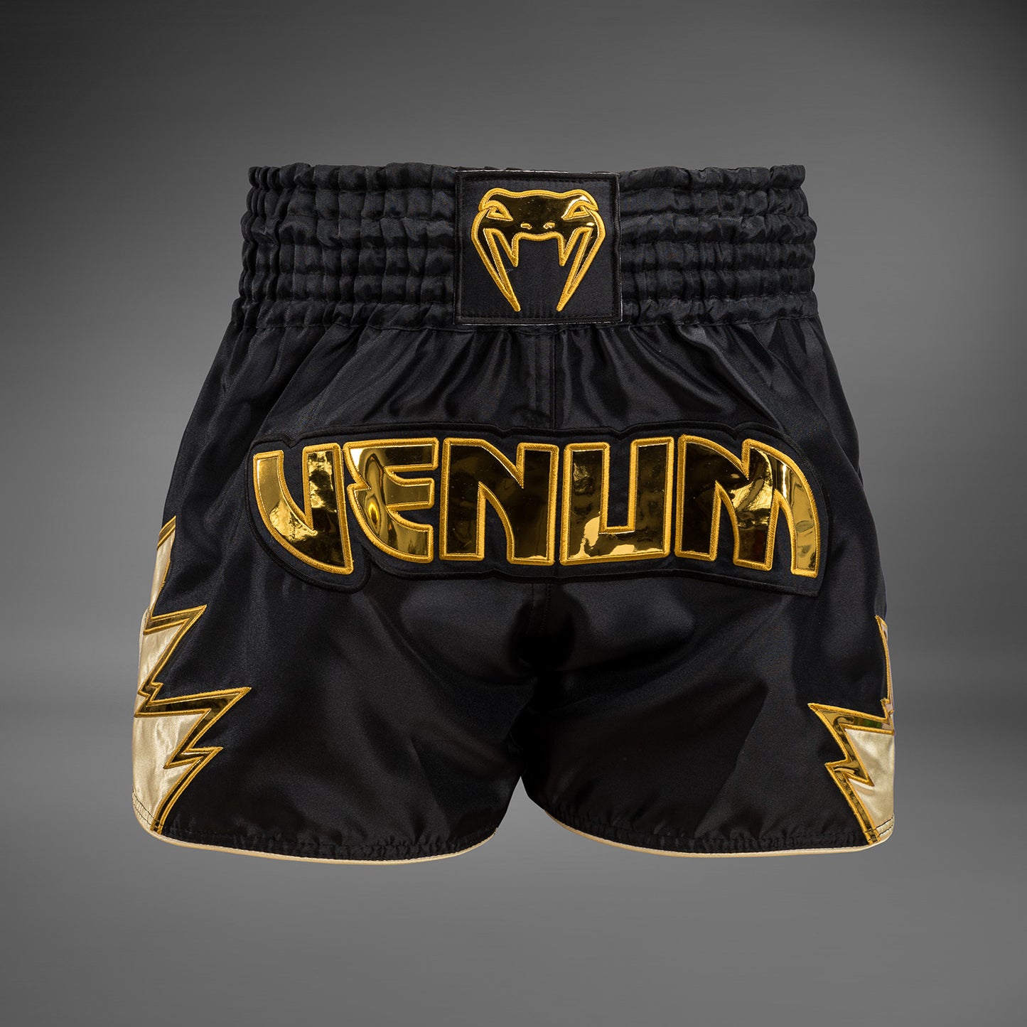 Venum Inferno Pantalones cortos de Muay Thai - Negro/Oro