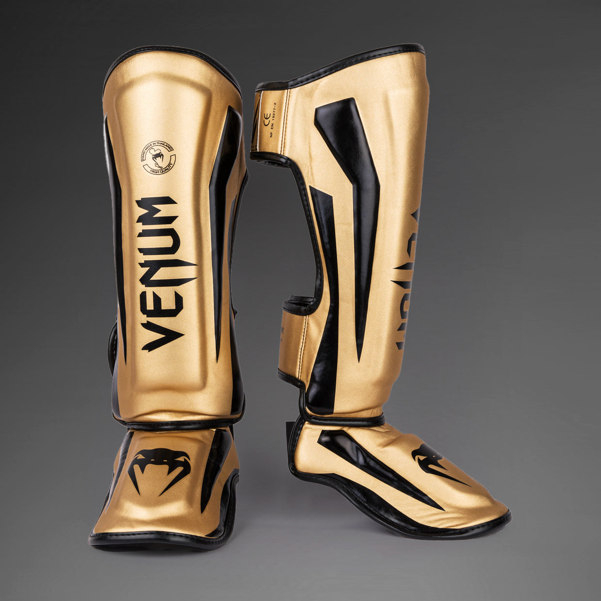 Venum Elite Espinilleras Standup - Oro/Negro