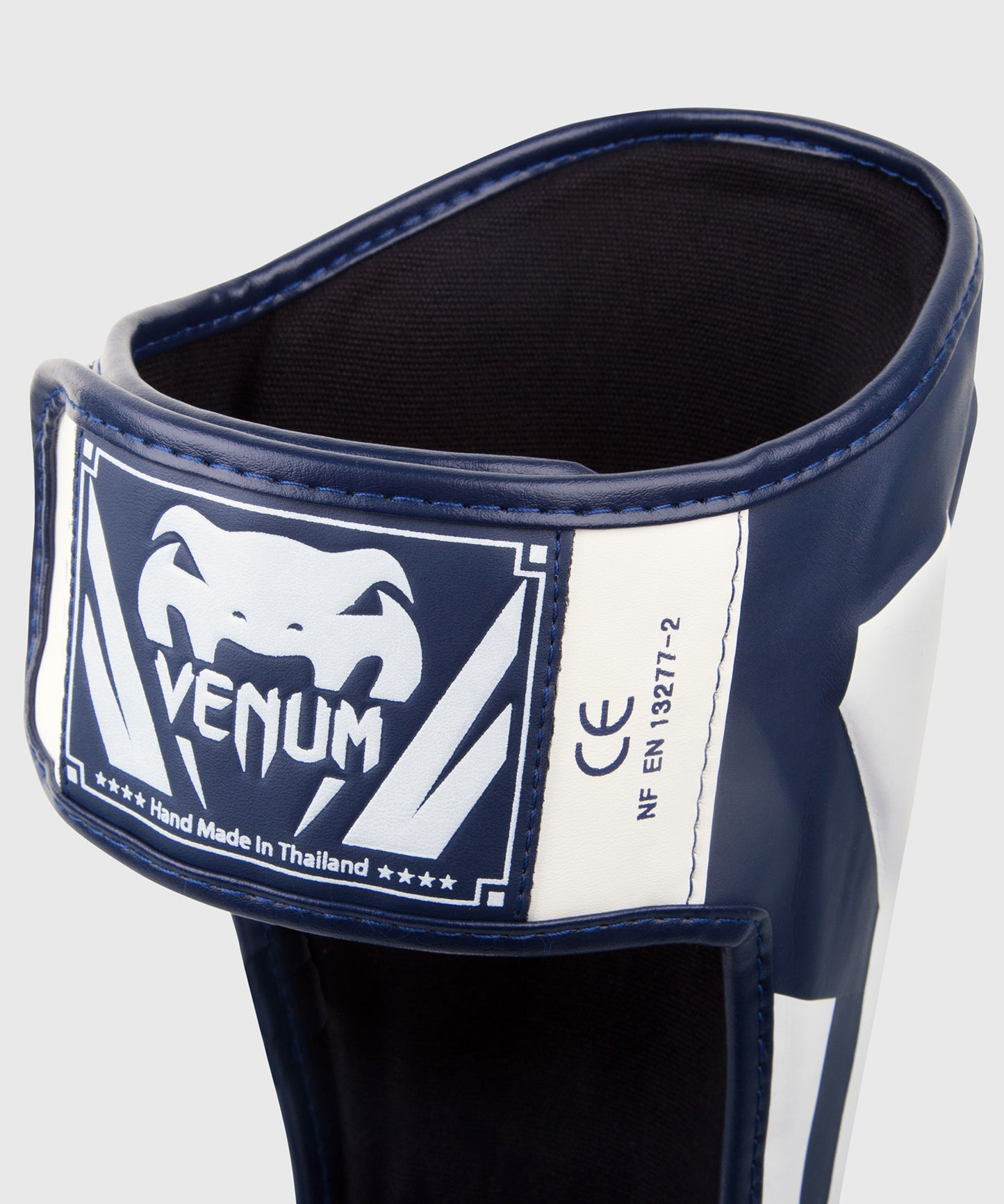 Espinilleras Venum Elite Standup - Blanco/Azul Marino