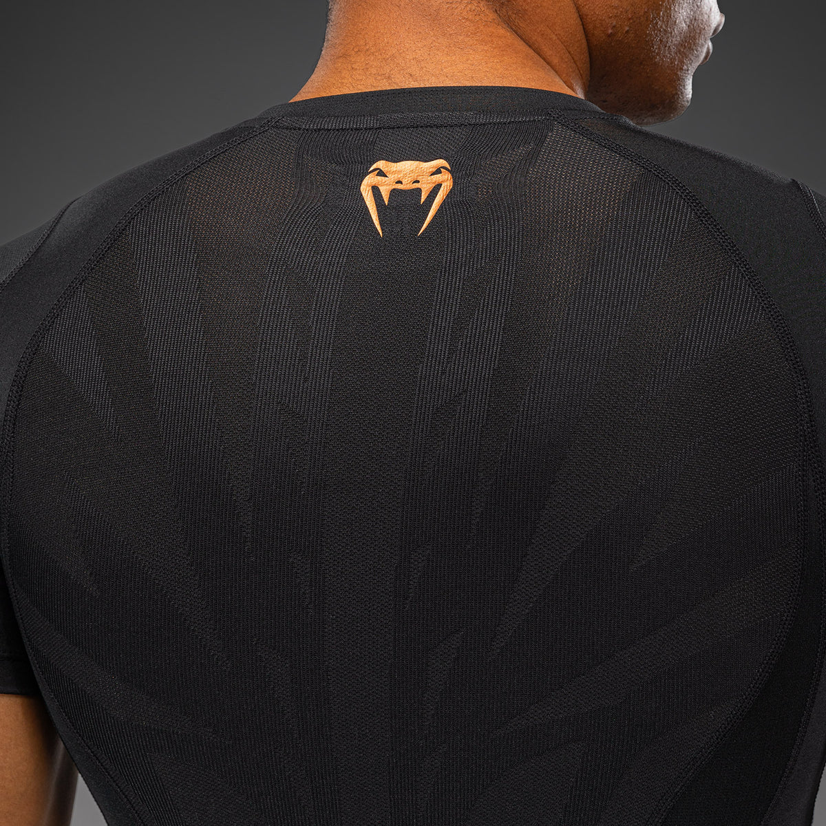 Venum G-Fit Revolution Rashguard de manga corta - Negro/Cobre