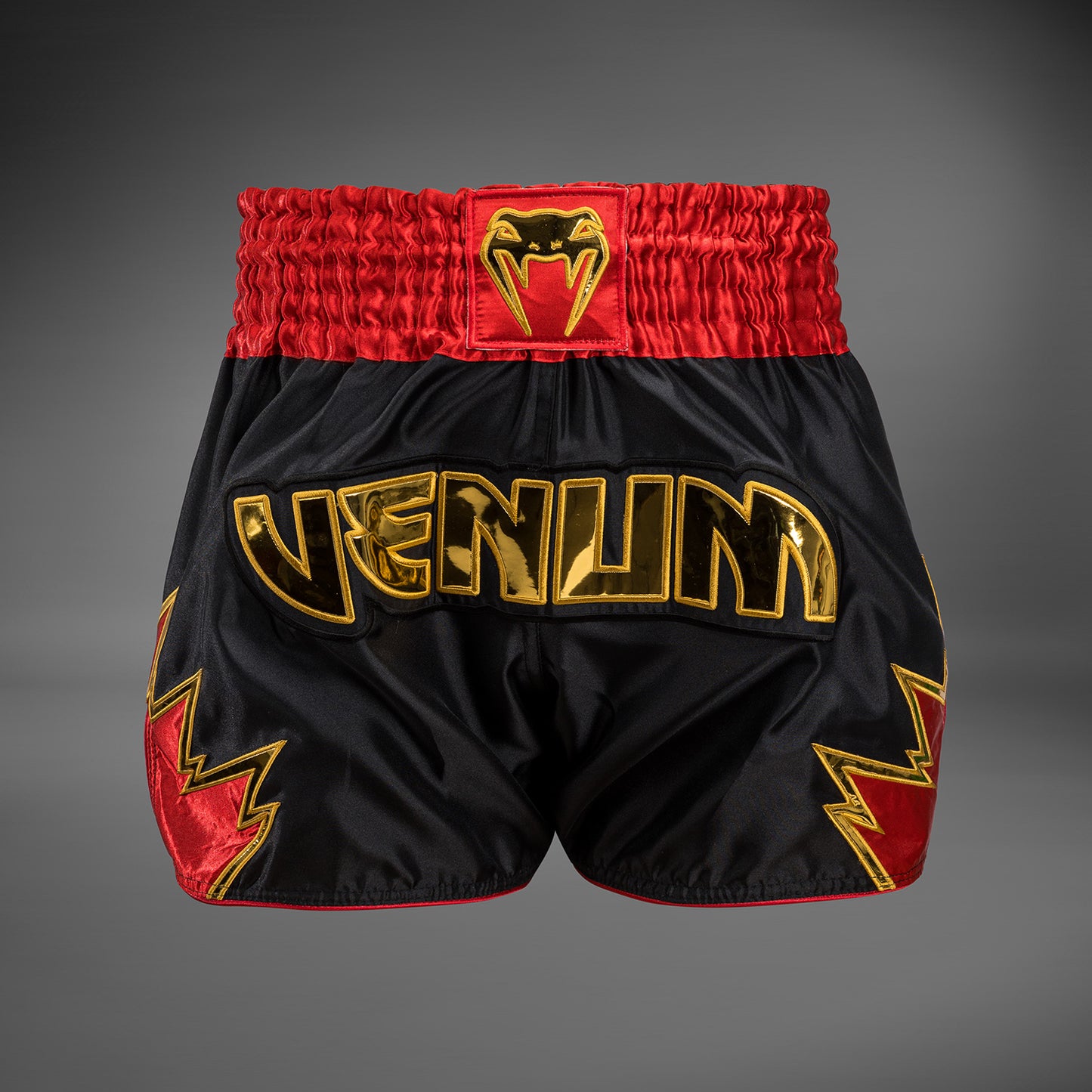 Venum Inferno Pantalones cortos de Muay Thai - Negro/Oro/Rojo
