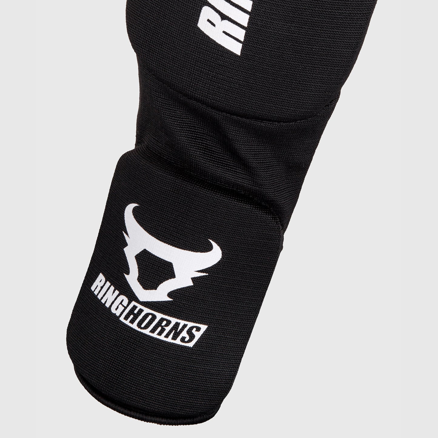 Ringhorns Kontact Espinilleras – Negro