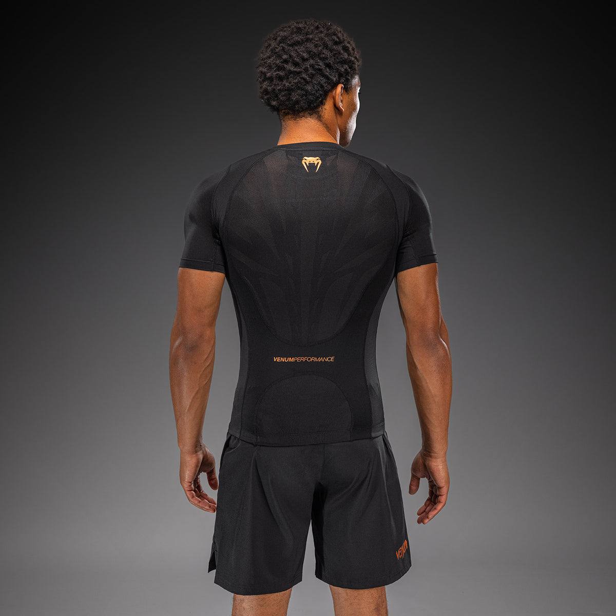 Venum G-Fit Revolution Rashguard de manga corta - Negro/Cobre