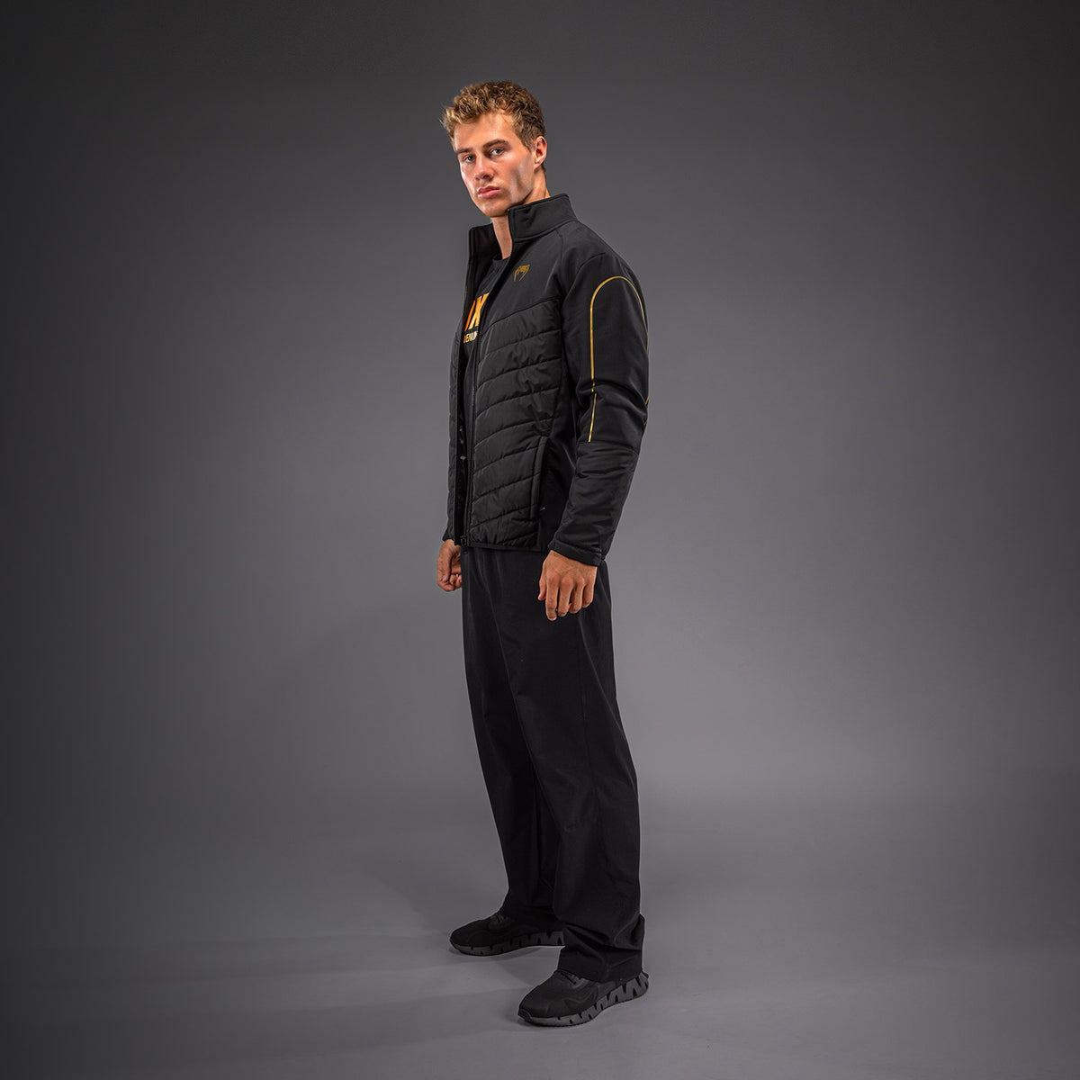 Venum Paddock Chaqueta softshell - Negro/Dorado