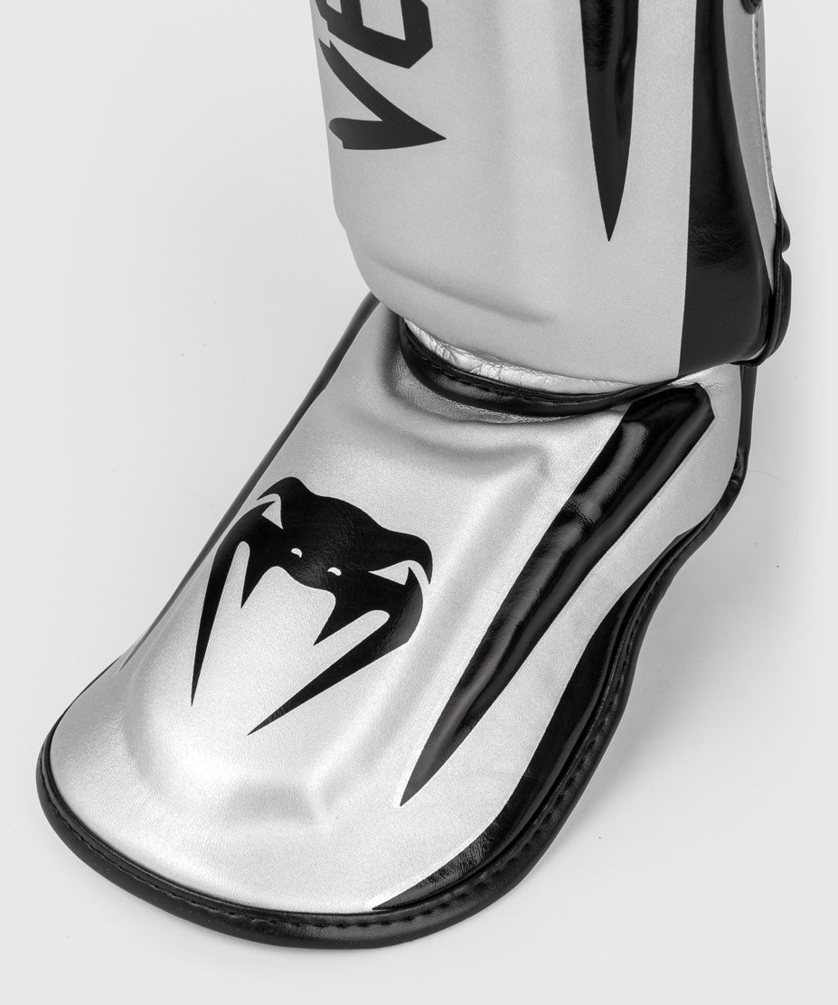 Venum Elite Espinilleras Standup - Plata/Negro