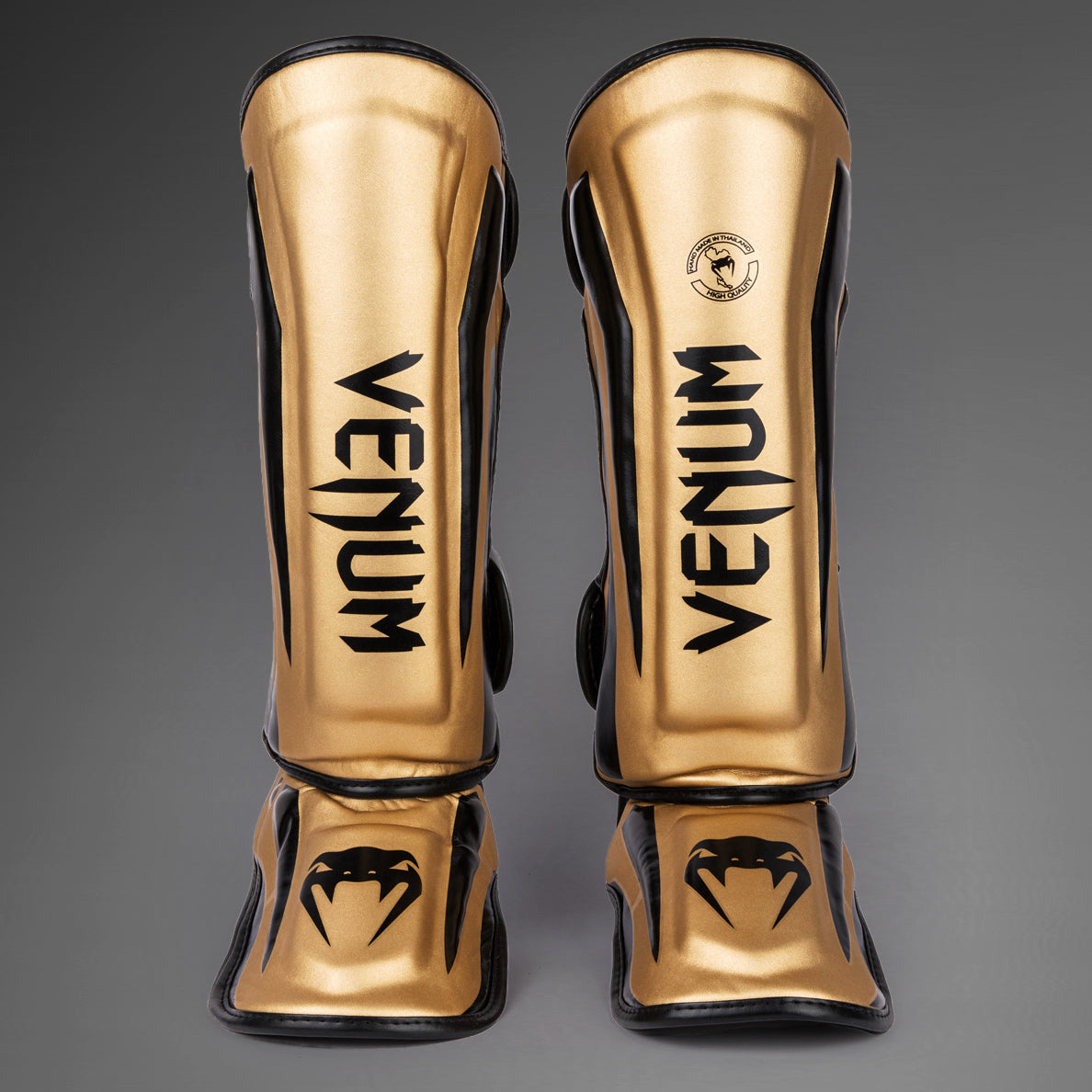 Venum Elite Espinilleras Standup - Oro/Negro