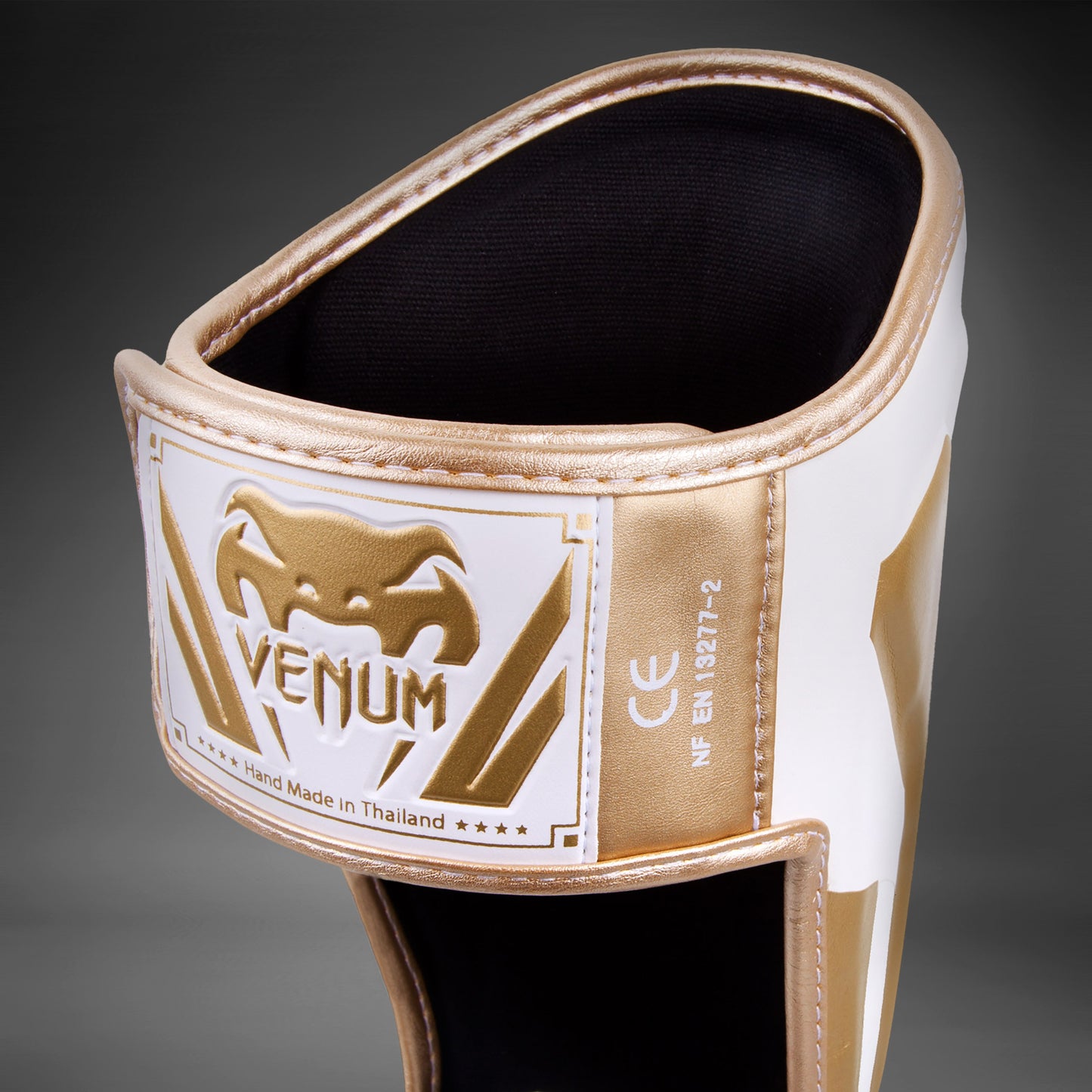 Espinilleras Venum Elite Standup - Blanco/Oro