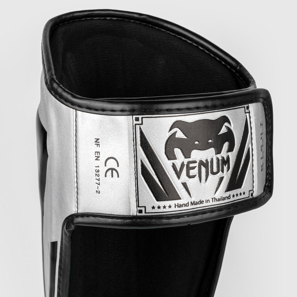 Venum Elite Espinilleras Standup - Plata/Negro