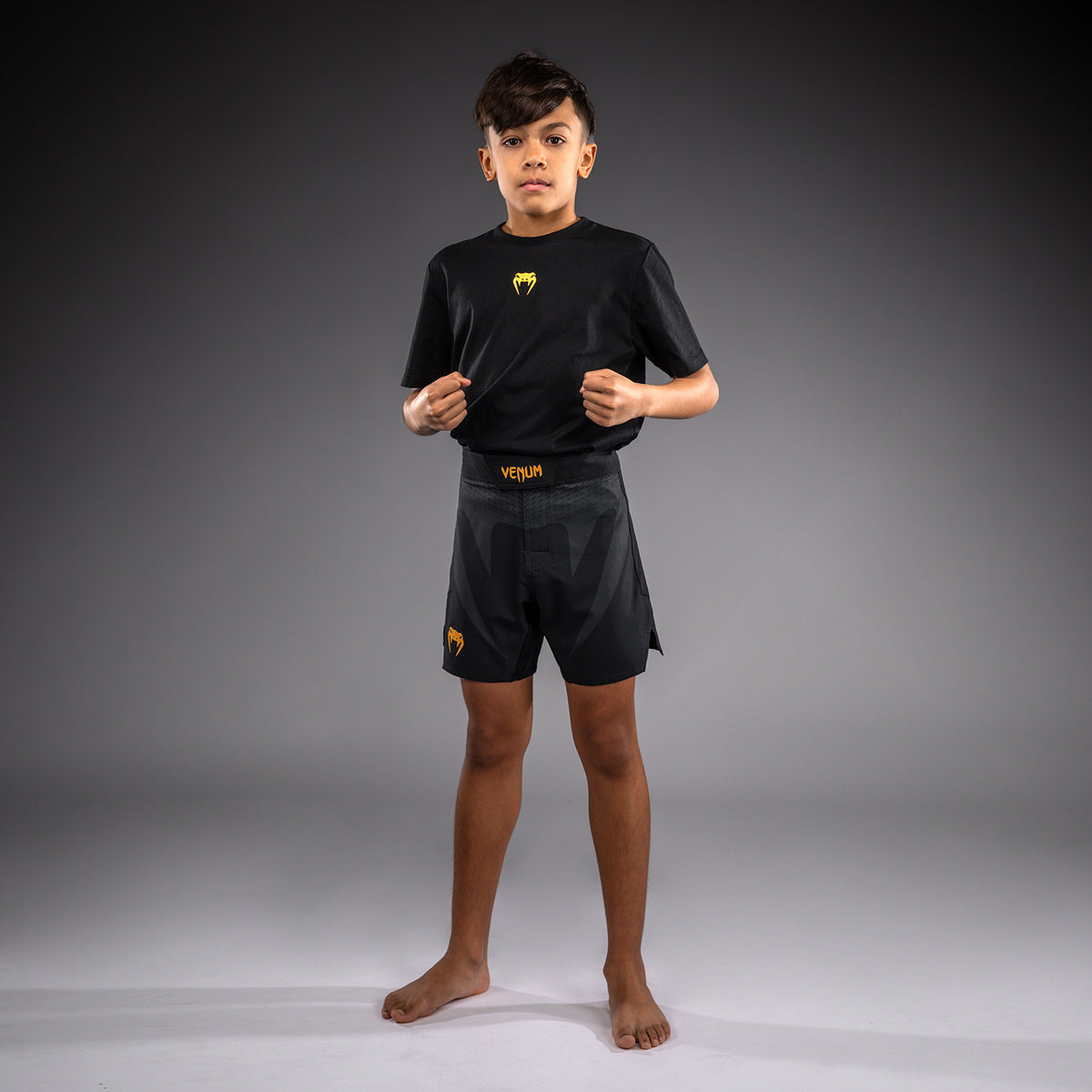 Venum Attack Fightshorts para niños - Negro/Dorado