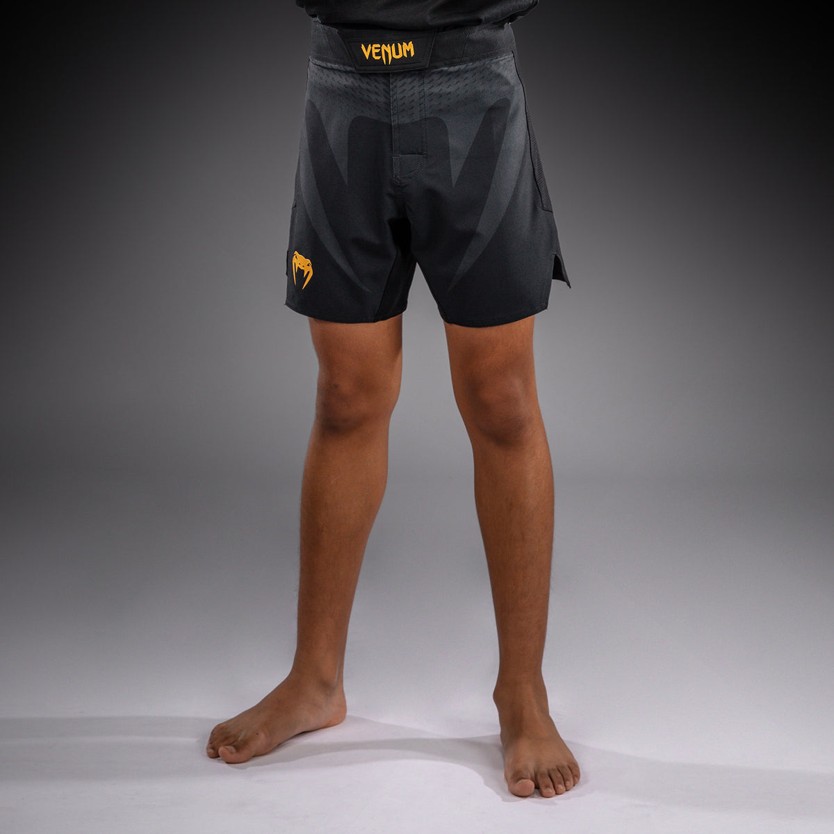 Venum Attack Fightshorts para niños - Negro/Dorado