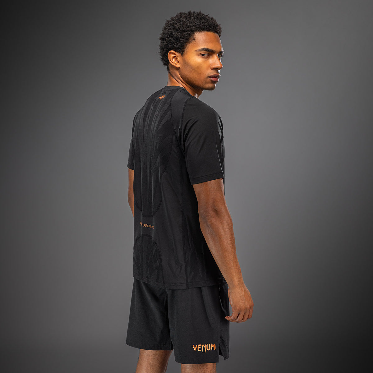 Venum G-Fit Revolution Camiseta Dry Tech - Negro/Cobre
