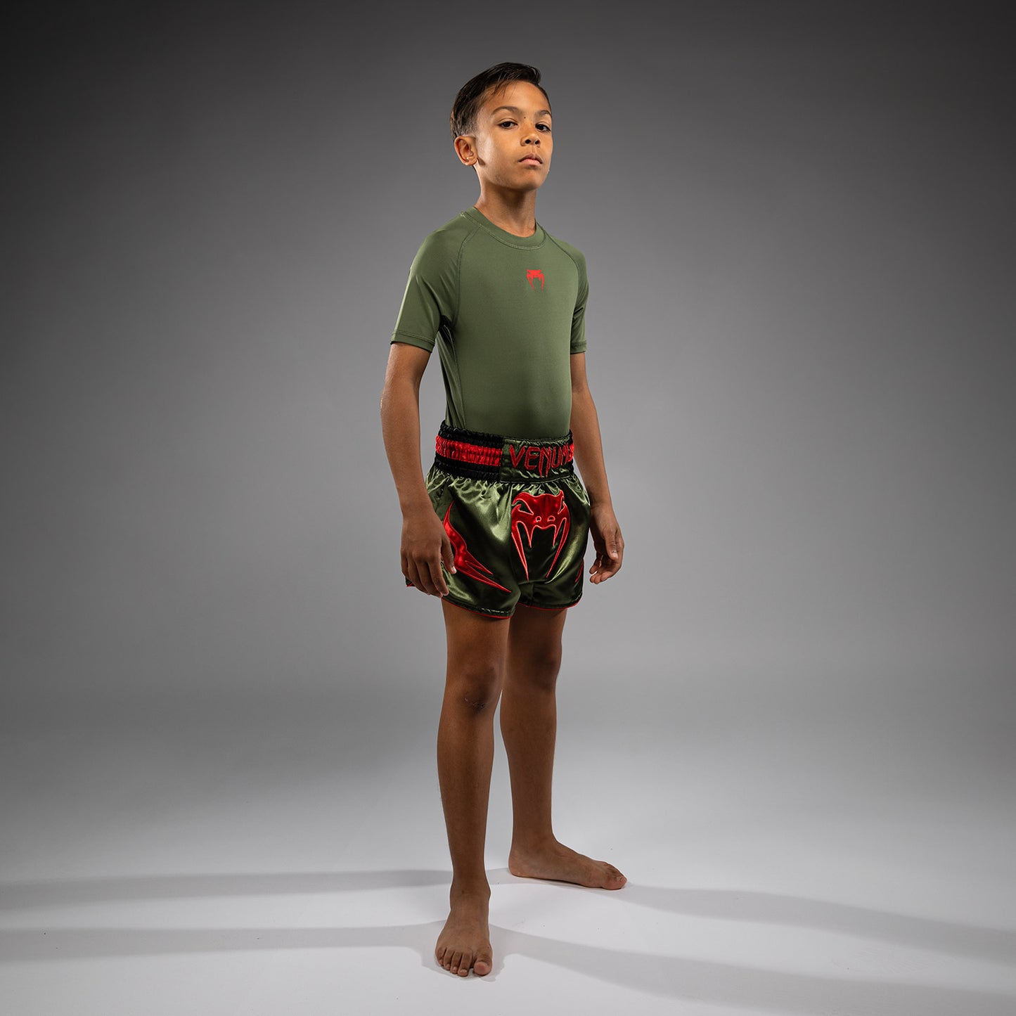 Venum Inferno Pantalones Cortos de Muay Thai para Niños - Verde Ejército/Naranja