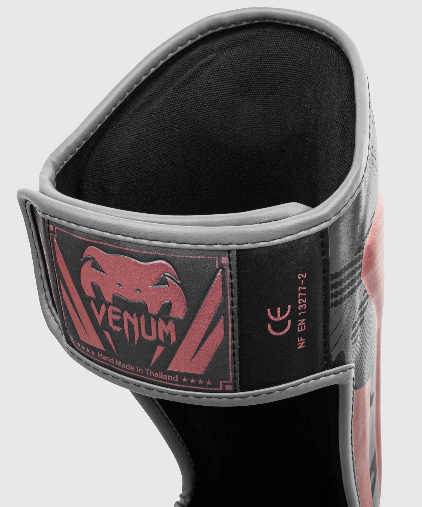 Espinillera Venum Elite - Negra/Rosa/Oro