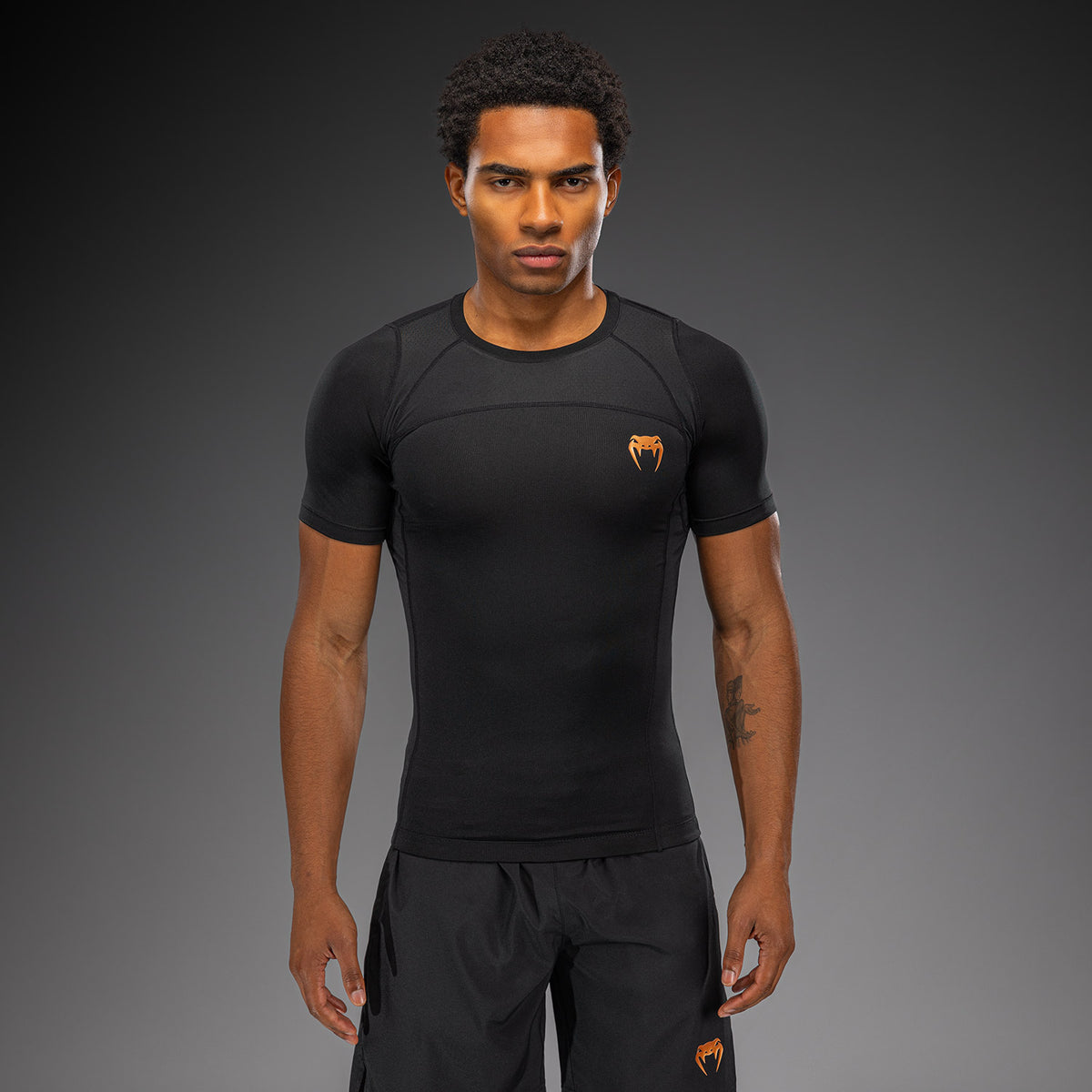 Venum G-Fit Revolution Rashguard de manga corta - Negro/Cobre